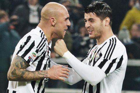 Simone Zaza of Juventus exults with teammate Alvaro Morata after scoring the winning goal of 1-0 during the italian serie A soccer match Juventus FC - SSC Napoli at Juventus Stadium, Turin, 13 February 2016. ANSA / ANDREA DI MARCO
