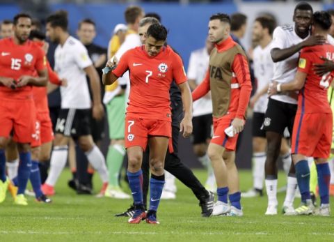 Chile's Alexis Sanchez, center, reacts at the end of the Confederations Cup final soccer match between Chile and Germany, at the St.Petersburg Stadium, Russia, Sunday July 2, 2017. Germany won 1-0. (AP Photo/Thanassis Stavrakis)