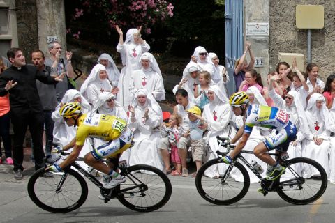 July 3, 2013. Race leader yellow jersey holder Orica Greenedge team rider Simon Gerrans of Australia cycles past Sisters of the Consolation congregation during the 228.5 km fifth stage of the centenary Tour de France cycling race from Cagnes-Sur-Mer to Marseille.