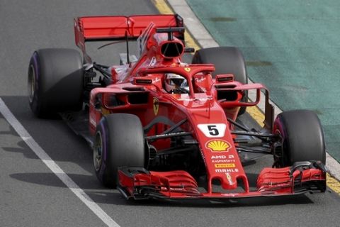 Ferrari driver Sebastian Vettel of Germany steers his car during the Australian Formula One Grand Prix in Melbourne, Australia, Sunday, March 25, 2018. (AP Photo/Rick Rycroft)