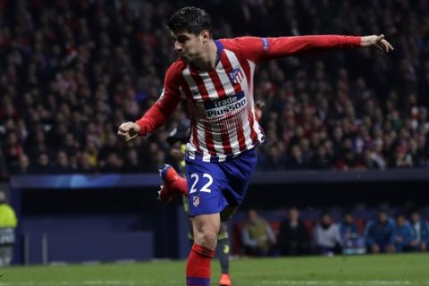 Atletico forward Alvaro Morata, right, heads the ball to score his side's opening goal and the goal was disallowed after a review by VAR during the Champions League round of 16 first leg soccer match between Atletico Madrid and Juventus at Wanda Metropolitano stadium in Madrid, Wednesday, Feb. 20, 2019. (AP Photo/Manu Fernandez)