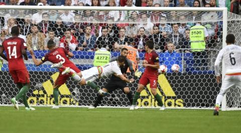 Mexico's Javier Hernandez scores during the Confederations Cup, Group A soccer match between Portugal and Mexico, at the Kazan Arena, Russia, Sunday, June 18, 2017. (AP Photo/Martin Meissner)
