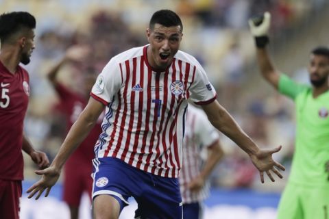 ADDS GOAL WAS ANNULLED - Paraguay's Oscar Cardozo celebrates scoring his side's second goal, which was later annulled, during a Copa America Group B soccer match against Qatar at Maracana stadium in Rio de Janeiro, Brazil, Sunday, June 16, 2019. (AP Photo/Leo Correa)