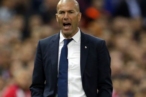Real Madrid's head coach Zinedine Zidane shouts instructions to his team during a Champions League semifinal, 2nd leg soccer match between Atletico de Madrid and Real Madrid, in Madrid, Spain, Wednesday, May 10, 2017 . (AP Photo/Daniel Ochoa de Olza)
