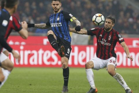 AC Milan's Ricardo Rodriguez, right, and Inter Milan's Mauro Icardi vie for the ball during an Italian Serie A soccer match between AC Milan and Inter Milan, at the San Siro stadium in Milan, Italy, Wednesday, April 4, 2018. (AP Photo/Antonio Calanni)