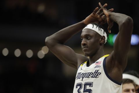 Marquette's Kur Kuath reacts to a call during the second half of an NCAA college basketball game against Villanova Wednesday, Feb. 2, 2022, in Milwaukee. (AP Photo/Aaron Gash)