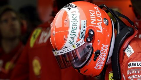 The name of three-time Formula One world champion Niki Lauda is written on the helmet of Ferrari driver Sebastian Vettel of Germany during the second practice session at the Monaco racetrack, in Monaco, Thursday, May 23, 2019. Three-time Formula One world champion Niki Lauda, who won two of his titles after a horrific crash that left him with serious burns and went on to become a prominent figure in the aviation industry, has died on May 21, 2109. He was 70. (AP Photo/Luca Bruno)
