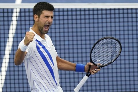Novak Djokovic, of Serbia, reacts to winning his match with Milos Raonic, of Canada, during the finals of the Western & Southern Open tennis tournament Saturday, Aug. 29, 2020, in New York. (AP Photo/Frank Franklin II)