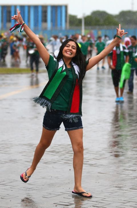 NATAL, BRAZIL - JUNE 13:  A Mexico fan braves the rain before the 2014 FIFA World Cup Brazil Group A match between Mexico and Cameroon at Estadio das Dunas on June 13, 2014 in Natal, Brazil.  (Photo by Julian Finney/Getty Images)