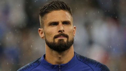 France's Olivier Giroud listens to the national anthem prior to his friendly soccer match against Ireland at the Stade de France stadium, in Saint Denis, north of Paris, France, Monday, May, 28, 2018. (AP Photo/Thibault Camus)