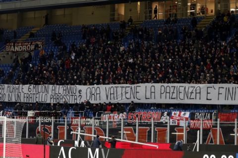 AC Milan fans display a banner during the Italian Cup soccer match between AC Milan and Hellas Verona, at the Milan San Siro stadium, Italy, Wednesday, Dec. 13, 2017. (AP Photo/Antonio Calanni)