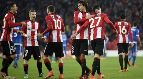 Athletic Bilbao's players celebrate after Sabin Merino scored during the UEFA Europa League Round of 32 second leg football match Athletic Club Bilbao vs Olympique de Marseille at the San Mames stadium in Bilbao on February 25, 2016.   / AFP / ANDER GILLENEA        (Photo credit should read ANDER GILLENEA/AFP/Getty Images)