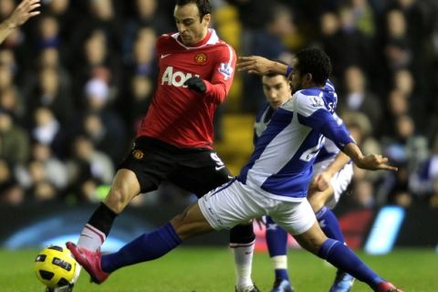 BIRMINGHAM, ENGLAND - DECEMBER 28:  Jean Beausejour of Birmingham City challenges Dimitar Berbatov of Manchester United during the Barclays Premier League match between Birmingham City and Manchester United at St Andrew's Stadium on December 28, 2010 in Birmingham, England. (Photo by Ross Kinnaird/Getty Images)