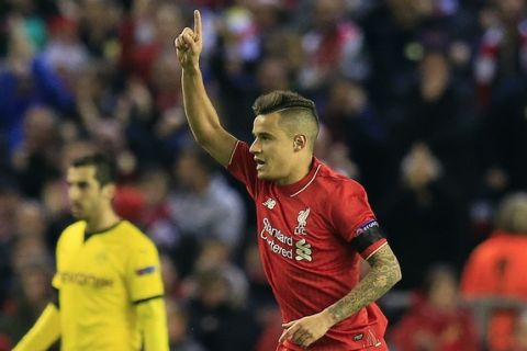 Liverpool's Philippe Coutinho celebrates after scoring during the Europa League quarterfinal second leg soccer match between Liverpool  FC and Borussia Dortmund in Liverpool, England, Thursday, April 14, 2016 . (AP Photo/Jon Super)
