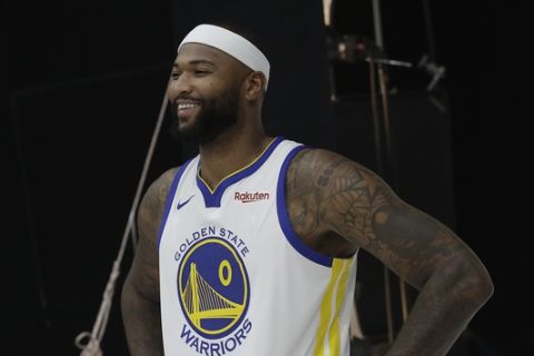 Golden State Warriors' DeMarcus Cousins poses for photos during media day at the NBA basketball team's practice facility in Oakland, Calif., Monday, Sept. 24, 2018. (AP Photo/Jeff Chiu)