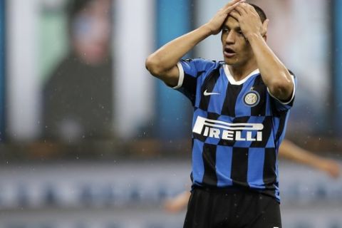 Inter Milan's Alexis Sanchez reacts after a missed scoring opportunity during a Serie A soccer match between Inter Milan and Fiorentina, at the San Siro stadium in Milan, Italy, Wednesday, July 22, 2020. (AP Photo/Luca Bruno)