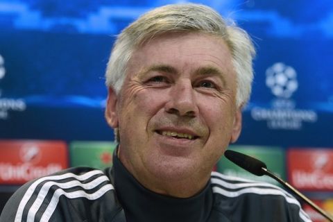 Real Madrid's Italian coach Carlo Ancelotti smiles during a press conference at Valdebebas Sport City in Madrid on April 13, 2015 on the eve of their UEFA Champions League quarter final first leg football match against Atletico de Madrid. AFP PHOTO/ PIERRE-PHILIPPE MARCOU        (Photo credit should read PIERRE-PHILIPPE MARCOU/AFP/Getty Images)