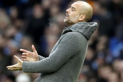 Manchester City manager Pep Guardiola gestures on the touchline during the English Premier League soccer match between Manchester City and Watford at the Etihad Stadium, Manchester, England, Saturday March 9, 2019. (Martin Rickett/PA via AP)