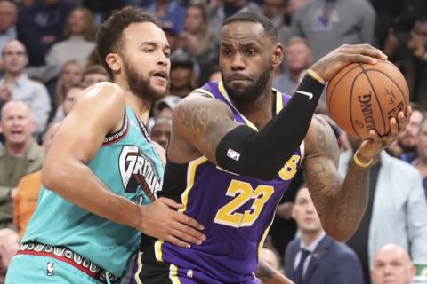 Memphis Grizzlies' Kyle Anderson (1) defends Los Angeles Lakers' LeBron James (23) in the second half of an NBA basketball game Saturday, Nov. 23, 2019, in Memphis, Tenn. (AP Photo/Karen Pulfer Focht)