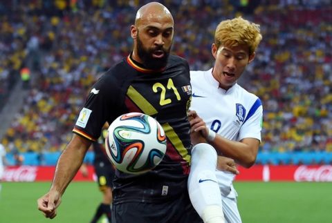 SAO PAULO, BRAZIL - JUNE 26:  Anthony Vanden Borre of Belgium and Son Heung-Min of South Korea compete for the ball during the 2014 FIFA World Cup Brazil Group H match between South Korea and Belgium at Arena de Sao Paulo on June 26, 2014 in Sao Paulo, Brazil.  (Photo by Stu Forster/Getty Images)