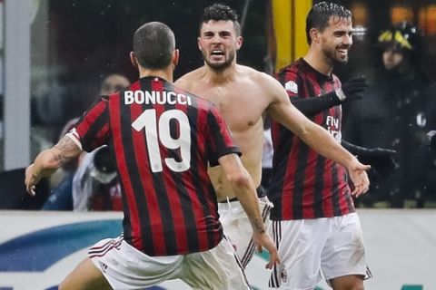 AC Milan's Patrick Cutrone, center, celebrates with his teammates after scoring for his team during an Italian Cup quarter-final soccer match between Milan and Inter Milan at the San Siro stadium in Milan, Italy, Wednesday, Dec. 27, 2017. (AP Photo/Antonio Calanni)