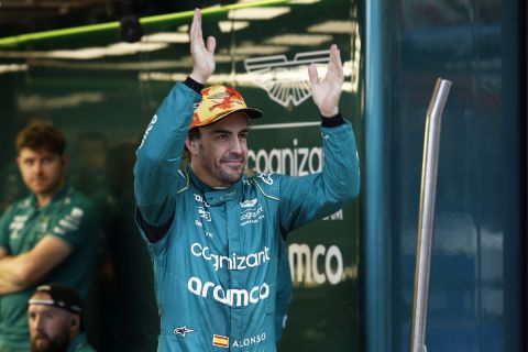 Aston Martin driver Fernando Alonso of Spain gestures to fans at the end of the second practice session for Sunday's Spanish Formula One Grand Prix, at the Barcelona Catalunya racetrack in Montmelo, Spain, Friday, June 2, 2023. (AP Photo/Joan Monfort)