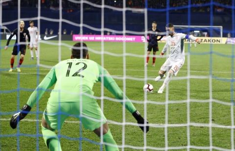 Spain's Sergio Ramos scores his side's second goal from the penalty spot past Croatia goalkeeper Lovre Kalinic during the UEFA Nations League soccer match between Croatia and Spain at the Maksimir stadium in Zagreb, Croatia, Thursday, Nov. 15, 2018. (AP Photo/Darko Bandic)