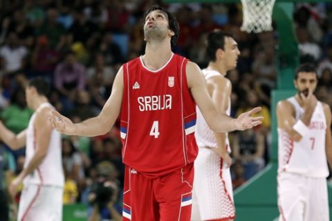 Serbia's Milos Teodosic (4) reacts after making a three-point basket during a quarterfinal round basketball game against Croatia at the 2016 Summer Olympics in Rio de Janeiro, Brazil, Wednesday, Aug. 17, 2016. (AP Photo/Charlie Neibergall)