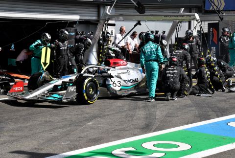 Pit crew work on the car of Mercedes driver George Russell of Britain during the Formula One Grand Prix at the Spa-Francorchamps racetrack in Spa, Belgium, Sunday, Aug. 28, 2022. (AP Photo/Geert Vanden Wijngaert, Pool)