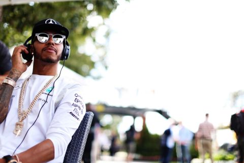 MELBOURNE, AUSTRALIA - MARCH 17: Lewis Hamilton of Great Britain and Mercedes GP listens to music in the Paddock during previews to the Australian Formula One Grand Prix at Albert Park on March 17, 2016 in Melbourne, Australia.  (Photo by Mark Thompson/Getty Images)