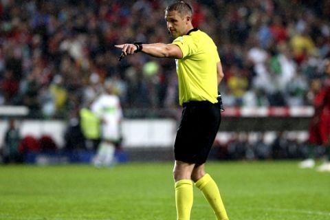 Referee Craig Pawson gestures during a friendly soccer match between Portugal and Algeria in Lisbon, Portugal, Thursday, June 7, 2018. (AP Photo/Armando Franca)