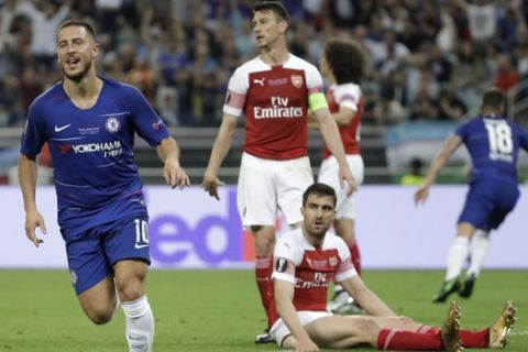 Chelsea's Eden Hazard, left, celebrates after scoring his side's fourth goal during the Europa League Final soccer match between Arsenal and Chelsea at the Olympic stadium in Baku, Azerbaijan, Wednesday, May 29, 2019. (AP Photo/Luca Bruno)