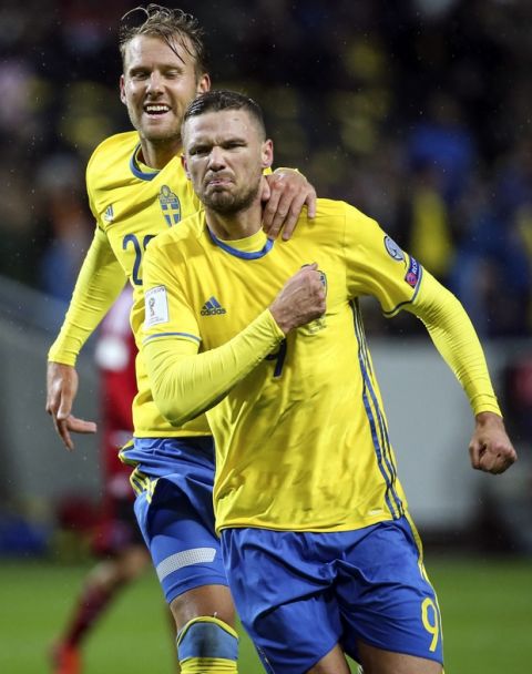 Sweden's Marcus Berg, front, celebrates scoring with teammate Ola Toivonen during the World Cup 2018 group A qualifying match between Sweden and Luxembourg at Friends Arena in Solna, Stockholm, Saturday Oct. 7, 2017. (Soren Andersson/TT via AP)