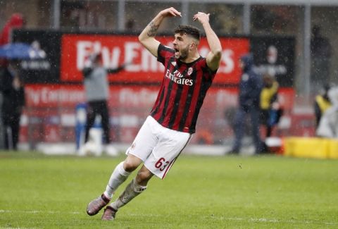 AC Milan's Patrick Cutrone celebrates after scoring his side's second goal during the Serie A soccer match between AC Milan and Chievo Verona at the San Siro stadium in Milan, Italy, Sunday, March 18, 2018. (AP Photo/Antonio Calanni)