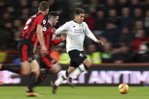 Liverpool's Roberto Firmino in action against Bournemouth during the English Premier League soccer match at the Vitality Stadium in Bournemouth, England, Sunday Dec. 17, 2017. (Andrew Matthews/PA via AP)