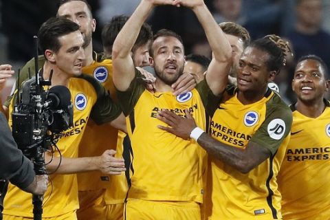 Brighton's Glenn Murray, center, celebrates with teammates after scoring his side's first goal during the English Premier League soccer match between West Ham and Brighton and Hove Albion at London Stadium in London, Friday, Oct. 20, 2017.(AP Photo/Kirsty Wigglesworth)