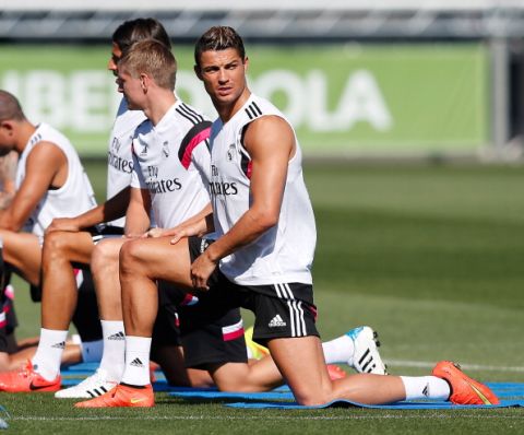 MADRID, SPAIN - AUGUST 07: Cristiano Ronaldo of Real Madrid stretches during a training session at Valdebebas training ground on August 7, 2014 in Madrid, Spain. (Photo by Antonio Villalba/Real Madrid via Getty Images)