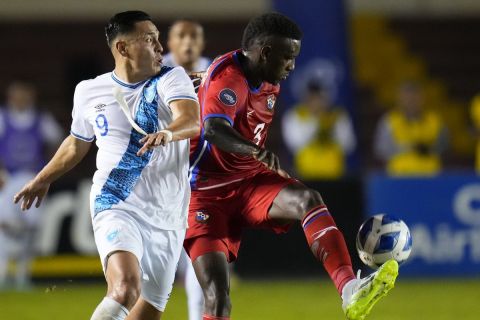 Panama's Jose Cordoba, right, and Guatemala's Rubio Rubin fight for the ball during a Concacaf Nations League soccer match at Rommel Fernandez stadium in Panama City, Tuesday, Oct. 17, 2023. (AP Photo/Arnulfo Franco)