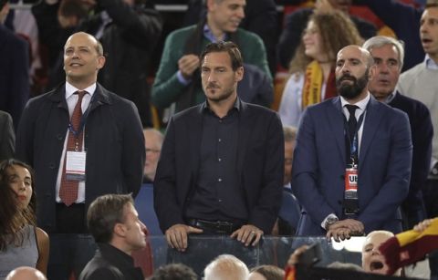Former Roma player Francesco Totti, center, looks down from the stands during the Champions League semifinal second leg soccer match between Roma and Liverpool at the Olympic Stadium in Rome, Wednesday, May 2, 2018. (AP Photo/Alessandra Tarantino)