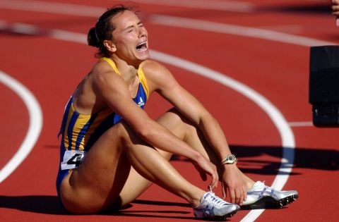 Ukraine's Zhanna Pintusevich-Block reacts after winning  the women's 100-meter final heat Monday, Aug. 6, 2001, during the World Track & Field Championships at Commonwealth Stadium in Edmonton, Alberta. (AP Photo/Laura Rauch)