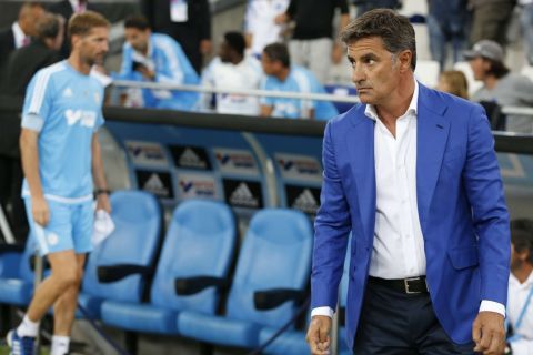 Marseille's new coach, Michel, walks on the pitch prior to a French League One soccer match against Troyes at the Velodrome stadium in Marseille, southern France, Sunday, Aug. 23, 2015. Spanish coach Jose Miguel Gonzalez del Campo, known as Michel, has been appointed by Marseille as the successor to Marcelo Bielsa. (AP Photo)/REB131/719789470074/1508232202