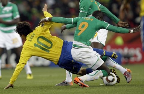 Brazil's Kaka, left, Ivory Coast's Cheick Tiote during the World Cup group G soccer match between Brazil and Ivory Coast at Soccer City in Johannesburg, South Africa, Sunday, June 20, 2010.  (AP Photo/Yves Logghe)