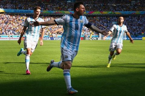 BELO HORIZONTE, BRAZIL - JUNE 21:  Lionel Messi of Argentina celebrates scoring his team's first goal during the 2014 FIFA World Cup Brazil Group F match between Argentina and Iran at Estadio Mineirao on June 21, 2014 in Belo Horizonte, Brazil.  (Photo by Ronald Martinez/Getty Images)