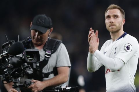 Tottenham's Christian Eriksen greets fans after the English Premier League soccer match between Tottenham Hotspur and Brighton & Hove Albion at Tottenham Hotspur stadium in London, Tuesday, April 23, 2019.(AP Photo/Frank Augstein)