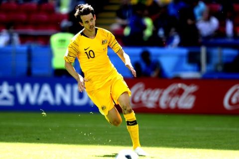Australia's Robbie Kruse goes with the ball during the group C match between France and Australia at the 2018 soccer World Cup in the Kazan Arena in Kazan, Russia, Saturday, June 16, 2018. (AP Photo/David Vincent)