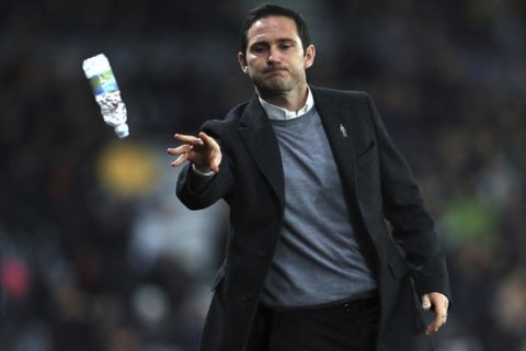 Derby County manager Frank Lampard throws a bottle of water during the Sky Bet Championship match at Pride Park, Derby, Monday December 17, 2018.(Mike Egerton/PA via AP)