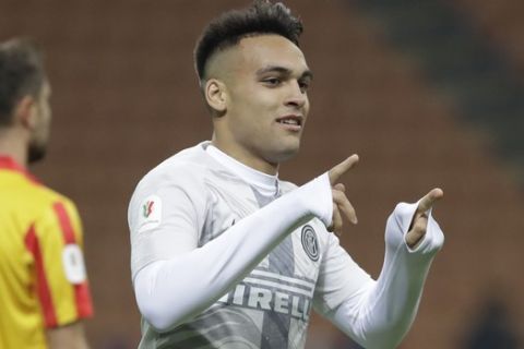 Inter Milan's Lautaro Martinez celebrates after scoring his team's fourth goal during an Italian Cup second round soccer match between Inter Milan and Benevento, at the San Siro stadium in Milan, Italy, Sunday, Jan. 13, 2019. (AP Photo/Luca Bruno)