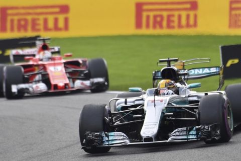 Mercedes driver Lewis Hamilton of Britain, right, leads into the first corner during the start of the Belgian Formula One Grand Prix in Spa-Francorchamps, Belgium, Sunday, Aug. 27, 2017. (AP Photo/Geert Vanden Wijngaert)