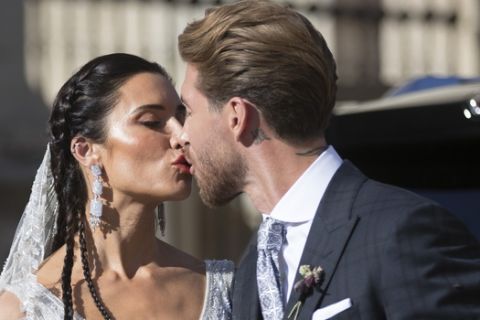 Real Madrid defender Sergio Ramos and model and presenter Pilar Rubio kiss to each other during their weeding ceremony at the Sevilla cathedral, Spain, Saturday, Jun 15, 2019. (AP Photo/Antonio Pizarro)