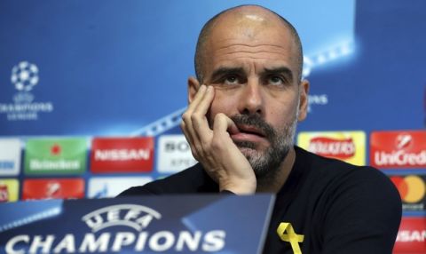 Manchester City soccer team manager Pep Guardiola reacts during the press conference in Manchester, England, Tuesday March 6, 2018. Manchester City play Basel in a Champions League clash upcoming Wednesday. (Martin Rickett/PA via AP)
